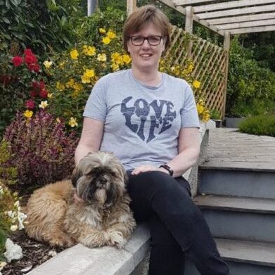 20200710-233654.jpg Lady sitting in garden with her brown small dog in a grey love life t-shirt